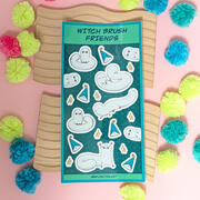 A photo of a sticker sheet with designs inspired by the manga Witch Hat Atelier, illustrated by Ayumutan Art