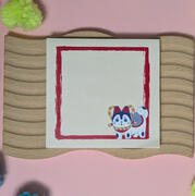 A pad of custom Post-it(tm) notes featuring an illustration of an Inu hariko doll by Ayumutan Art
