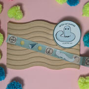 A photo of a roll of washi tape with a design inspired by the manga Witch Hat Atelier, illustrated by Ayumutan Art